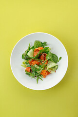 salad with salmon, vegetables and sauce