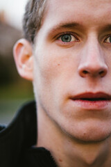 Close up of teenage boy face and eye looking serious
