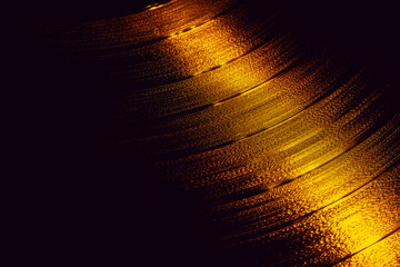 golden Vinyl record rotating in a macro shot