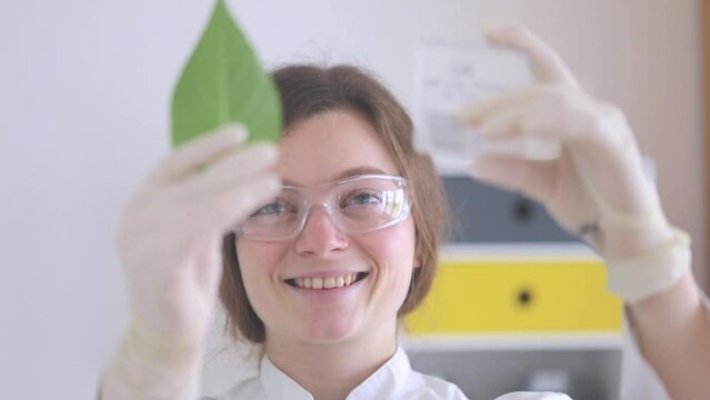 scientist female working with lab glasses and lab gloves