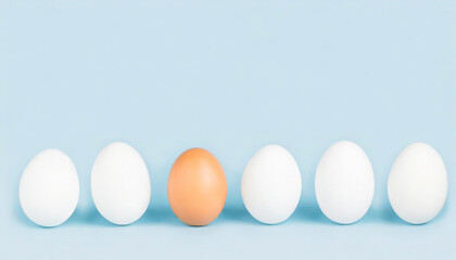 One brown egg standing out of white eggs isolated on light blue background with copy space, aligned. Concept of uniqueness, one out, standing out
