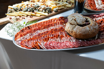 Tray of different types of Iberian sausages, red meat, fuet, chorizo, salami, salchichon, lomo,...