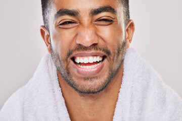 Man, portrait and happiness for teeth whitening in studio with health, wellness and smile by...