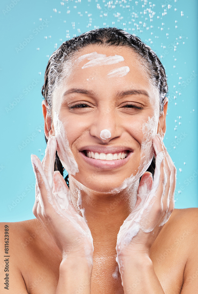 Poster Portrait, shower and happy woman with soap in studio for skincare, hygiene or wellness isolated on blue background. Water, foam bath or model cleaning face for dermatology, health or beauty cosmetics