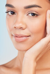 Obraz premium Young woman, portrait and fresh face in studio background for skincare, cosmetics and self care or beauty. Female person, dermatology or grooming for wellness, hygiene and anti aging or glow