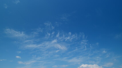 Daylight exotic horizon in tropical summer sunlight. Beautiful sunny blue sky background with tiny...