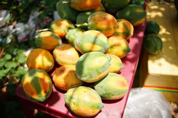 A lot of ripe, ready to eat papaya organised on a table in Long An province, southern Vietnam