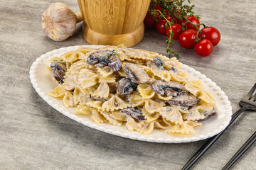 Italian cuisine - farfalle with mushrooms