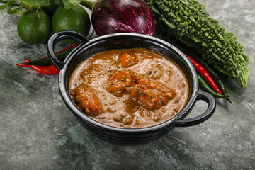Indian cuisine - chicken curry with spices
