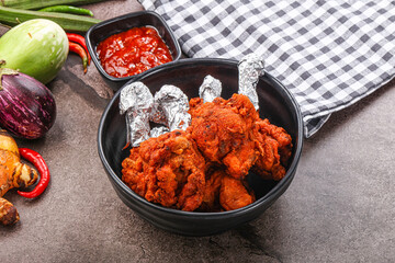 Indian cuisine glazed chicken lollipop