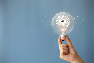 AI, Machine learning, Hand holding light bulb with virtual Artificial Intelligence and virtual...