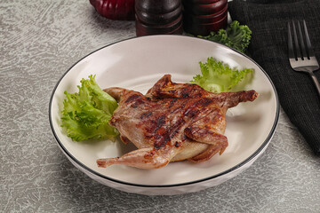 Grilled quail in the plate