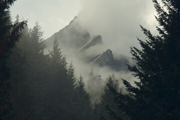 Misty mountaintops and fast moving clouds surround Vesper peak i