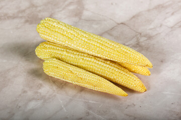 Raw sweet baby corn heap