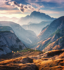 Mountain canyon lighted by bright sunbeams at sunset in autumn
