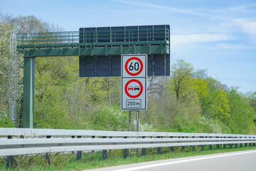 Car speed limit 60 sign and overtaking is prohibited on the autobahn. Automotive industry.