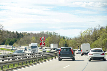 Car speed limit 120 sign on the autobahn. Automotive industry.