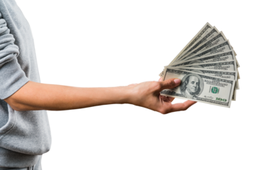 A hand holding a spread of US dollar bills, isolated on a white background, showing the concept of wealth