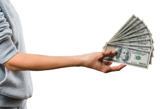 A hand holding a spread of US dollar bills, isolated on a white background, showing the concept of wealth