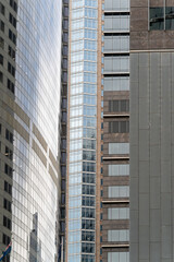 Fototapeta premium close up office building skyscraper city window glass reflections 