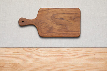 Teak handmade wooden cutting board on the countertop. wooden cutting board.