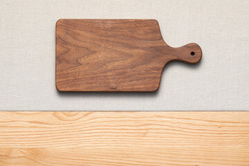 Handmade walnut wood cutting board on countertop. Walnut wood cutting board.