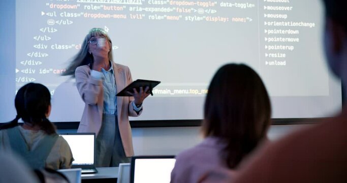 University, female lecturer and coding on projector screen for data structure, web development or html in class. Back, syntax and mature woman with students for education, programming or algorithm - Powered by Adobe