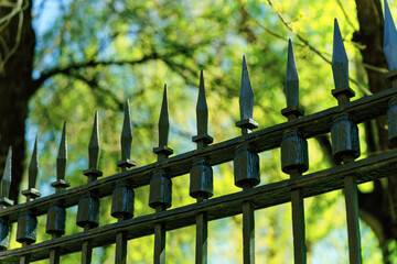 Top part of a metal fence with very sharp tips
