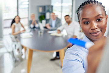 Black business woman, presentation or meeting writing notes for collaboration, teamwork and planning. Female person, group or coworkers together in boardroom for brainstorming, discussion or idea