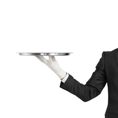A person in a black suit and white gloves holding a silver tray isolated on a white background - the concept of service and presentation