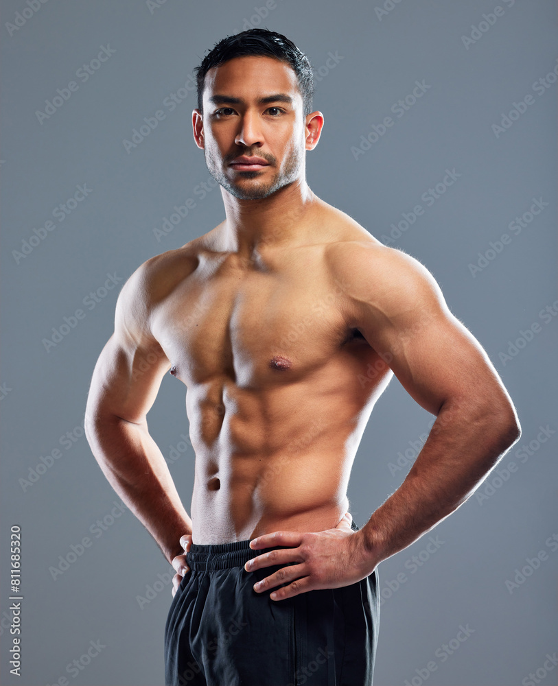 Poster Portrait, man and fitness for muscle in health, wellness and workout in studio background for sports training. Male person, athlete and strong for progress as bodybuilder for results in grey backdrop