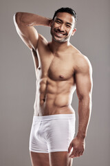 Portrait, man and smile for fitness in health, wellness and underwear, body and sexy in studio...