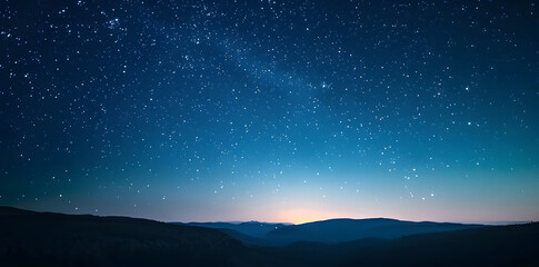 Fototapeta premium Blue night starry sky, space background. Wallpaper with a serene blue night sky