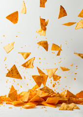 A pile of tortilla chips falling down.