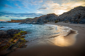 Sunset view of Minas Cove in the Cabo Cope and Puntas de Calnegre Regional Park, with crystal clear...