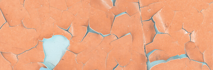 Peeling paint on the wall. Old concrete wall with cracked flaking paint. Weathered rough painted...