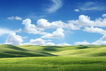 A beautiful summer or spring landscape with green grass on the hills and green fields. The blue sky is filled with white clouds and bright sunlight. Nature as a background.