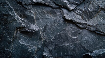 Slate background or texture in dark shades of grey and black
