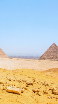 full HD 1080 Vertical video footage, Archeology photography, Seven Wonders of the World. Great Pyramids of Giza, panoramic 3 Pyramids view, selective focus with shallow depth of field.  Cairo Egypt