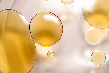 Macro close-up of oil droplets floating on water.