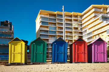 Brightly painted summer beach change rooms