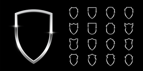 Black shields with silver frame set for emblem, badge, label. Vector luxury design elements. Royal medieval military armor collection isolated on black background. War trophy, heraldic symbol