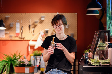 In a cozy home goods store, a young adult closely inspects an aromatherapy diffuser, reflecting...