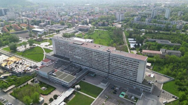 Aerial footage of the Saint George university hospital in Plovdiv.  Drone shot of the state medical hospital Sveti Georgi in the second largest city of Bulgaria. Brutalist architectures of surgeries.
