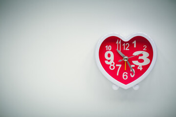 heart clock on background.