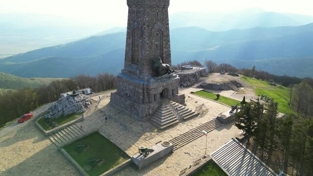 Aerial drone footage of the Monument of Freedom on top of Saint Nikola peak on Stara Planina in Bulgaria. High angle shot of the Liberty Memorial in the Balkan mountains. Orbit flyover sunny cloudy.
