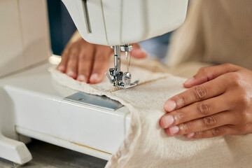 Professional, hands and machine for sewing fabric for stitching, fixing tear and creativity by...