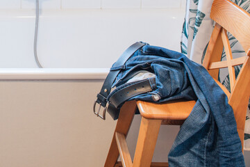 Taken off jeans left on chair before showering in bathroom