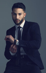 Professional, watch and man in suit with fashion for business in studio, dark background or...