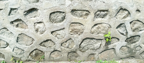 The walls of the house are made of natural stone